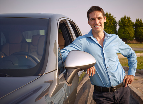 The man standing next to the car