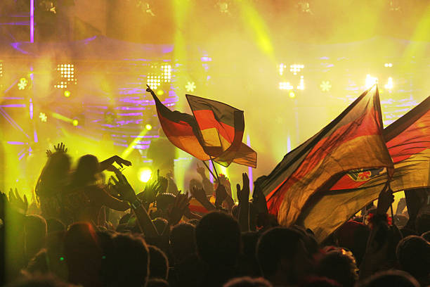 Germany wins: FIFA 2014 World Cup Champion Party, Berlin, Germany Berlin, Germany - July 13, 2014: Germany wins FIFA World Cup 2014, crowd of people gathering at Brandeburger Tor in Berlin for partying, getting crazy and supporting their team. A night of joy and happiness, with flags, music, lights and ecstatic crowd. football2014 stock pictures, royalty-free photos & images