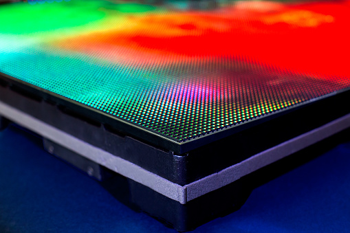 Close up picture of bright colored LED SMD screen module side - shallow depth of field background