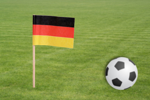 Soccer field with football and german flag