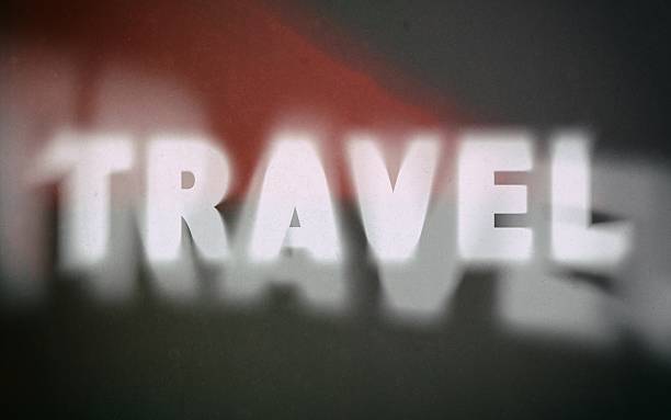 Travel word on vintage blurred background