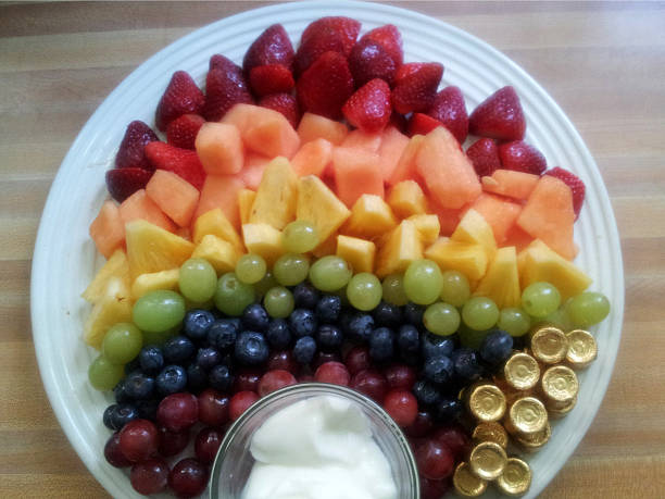 istock Rainbow Fruit Salad With A Pot Of Gold 502417858