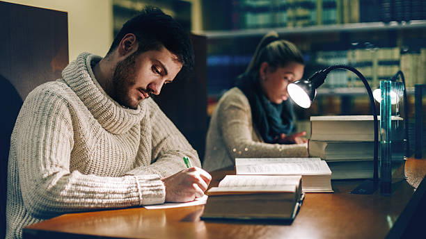 istock Group of Students Studying in a Library 502417934