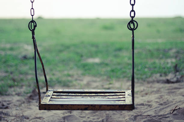 istock Swing with the green  beach background 502418764