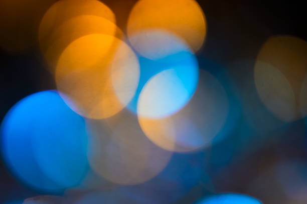 istock Orange and blue defocused lights background 502418898