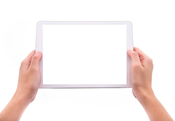 istock female hands holding a tablet with isolated screen 502420103