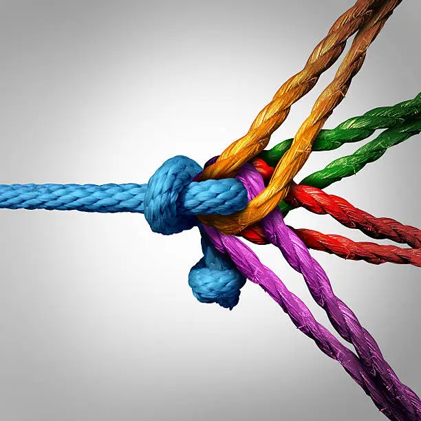 Connected group concept as many different ropes tied and linked together as an unbreakable chain as a community trust and faith metaphor for dependence and reliance on trusted partners for team and teamwork support and strength.