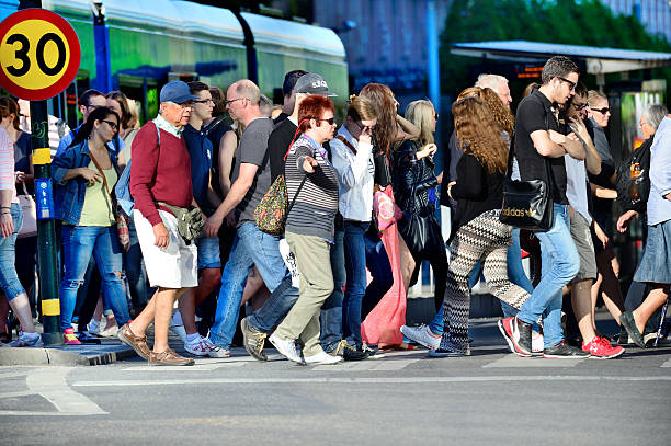 istock Crowd crossing street, tram in background 502421975