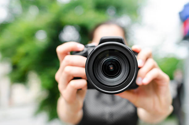 istock Young smiling girl making photo 502422449