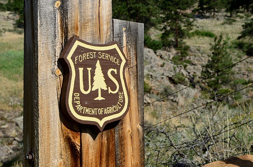 Lyons, Colorado, USA - July 24, 2013: The emblem of the US Forest Service, part of the Department of Agriculture outside of Lyons, Colorado.