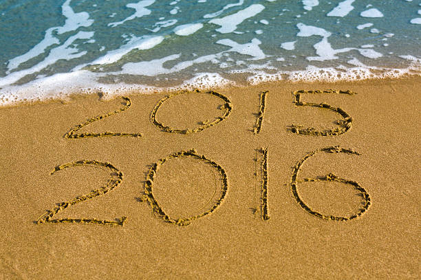 istock Happy New Year 2016 replace 2015 concept on sea beach 502425818