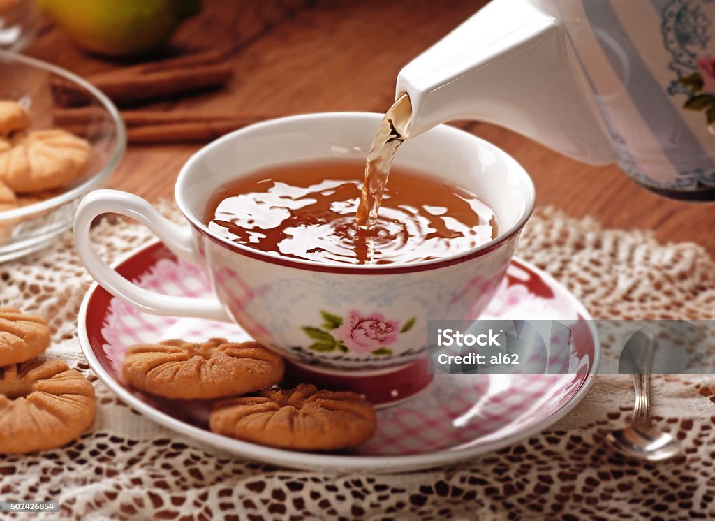 pour the tea pour the hot tea in porcelain cup Tea Room Stock Photo