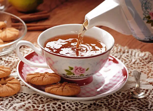 pour the hot tea in porcelain cup