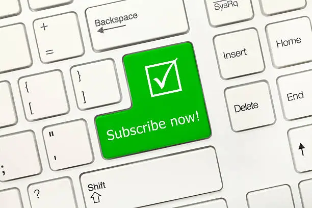 Photo of White conceptual keyboard - Subscribe Now (green key)