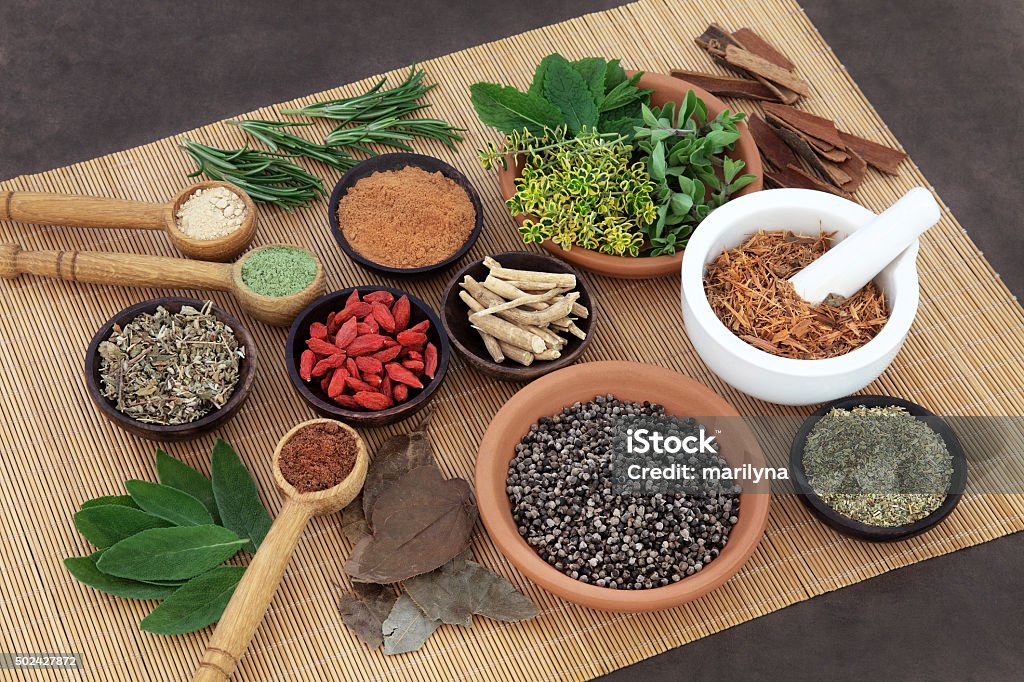 Herbal Health for Men Herb and spice selection used in herbal health for men on bamboo mat. Saw Palmetto Stock Photo