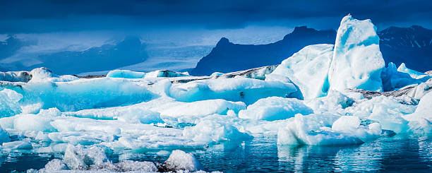 istock Bright white icebergs creaking in blue lagoon glacier panorama Iceland 502444802