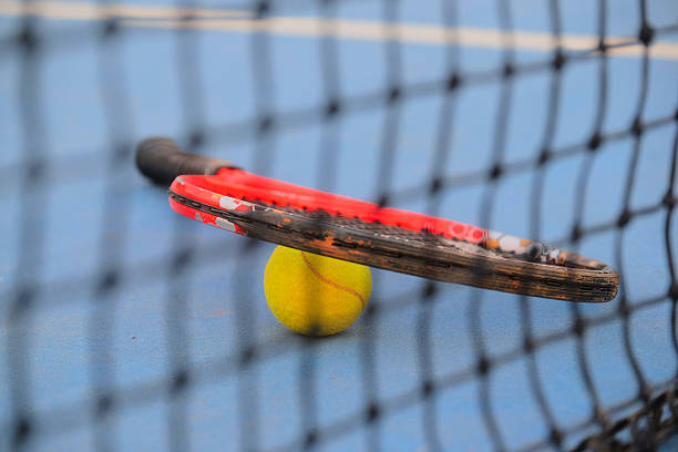 istock tennis ball and tennis racket 502445408