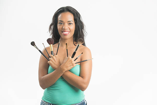 istock Happy  woman with many brushes for makeup applying 502448740