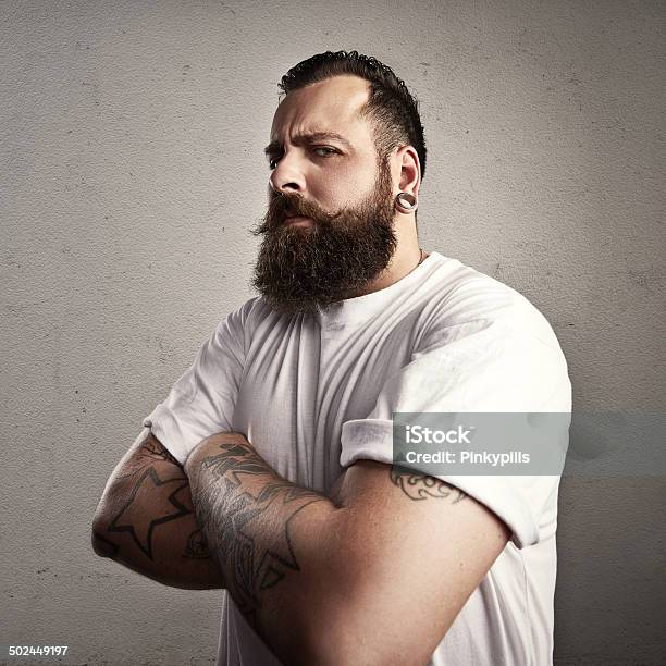 Tattooed Brutal Man Wearing White Tshirt Stock Photo - Download Image Now - Tattoo, Men, Rough