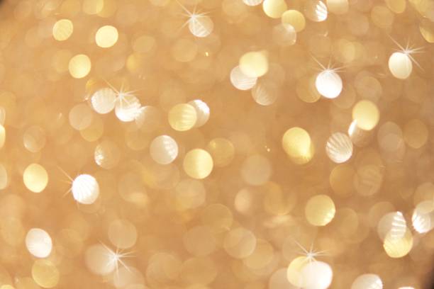 De-focused gold abstract Christmas background copy space bokeh