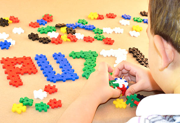 istock Sweet child build a cube with puzzle blocks 502451796