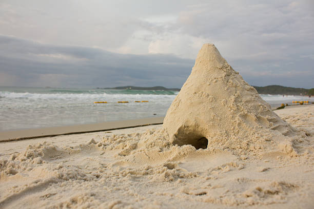 mountain sand on beach sun rise stock photo