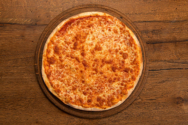 istock plain margherita pizza on a wooden cutting board 502452692
