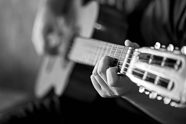istock hand playing acoustic guitar 502452893