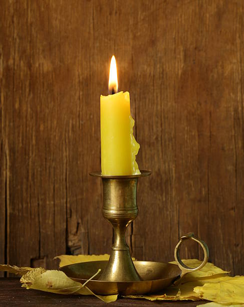 istock vintage candlestick with candle on the wooden background 502452943