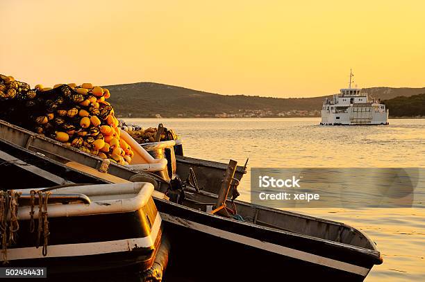 Fishing Boat With Fishing Net In The Harbor At Sunset Stock Photo - Download Image Now