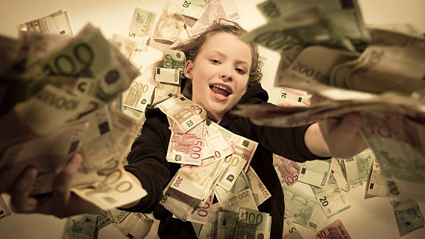 リッチな女の子を重ねた札束出力 - ten dollar bill ストックフォトと画像