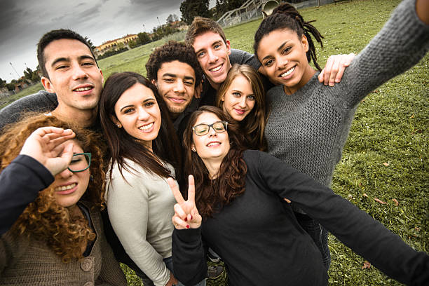 istock Group of college student laughing and doing a selfie 502457022