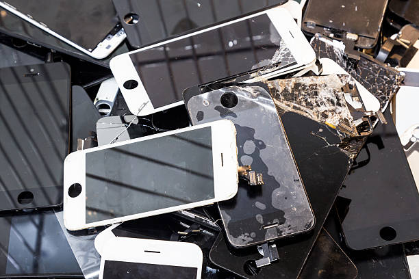 istock Stack of damaged smart phone body and cracked LCD screen 502458226
