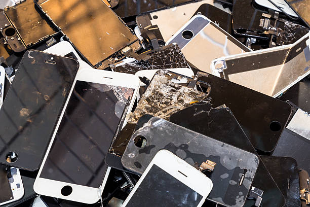 istock Stack of damaged smart phone body and cracked LCD screen 502458262