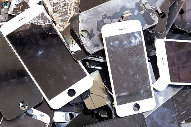 istock Stack of damaged smart phone body and cracked LCD screen 502458298