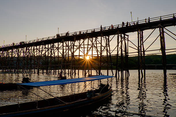 Wooden Mon Bridge during sunset Wooden Mon Bridge during sunset, Sangkhla Buri,Kanchanaburi, Thailand sangkhla stock pictures, royalty-free photos & images