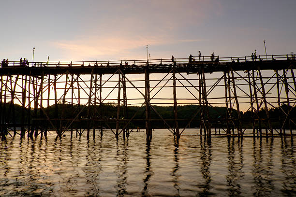 Wooden Mon Bridge during sunset Wooden Mon Bridge during sunset, Sangkhla Buri,Kanchanaburi, Thailand sangkhla stock pictures, royalty-free photos & images