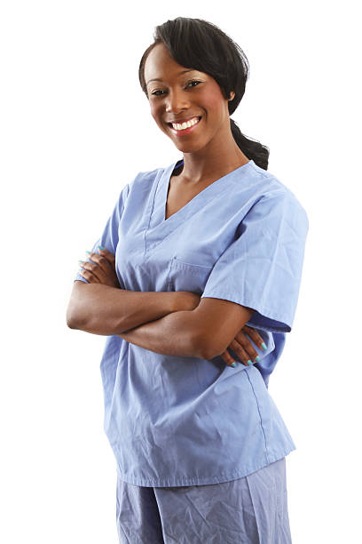 istock African american nurse with folded arms - smiling 502473247