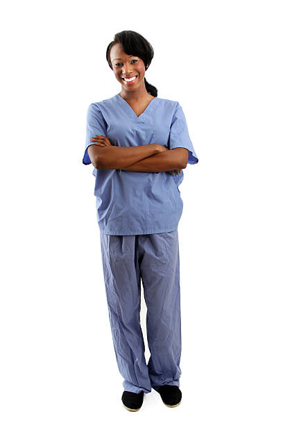 istock African american nurse with folded arms - full body 502473261