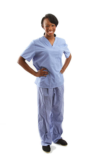 istock African american nurse with hands on hips - full body 502473271