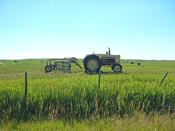 istock Vintage Tractor In Hay Field 502475013