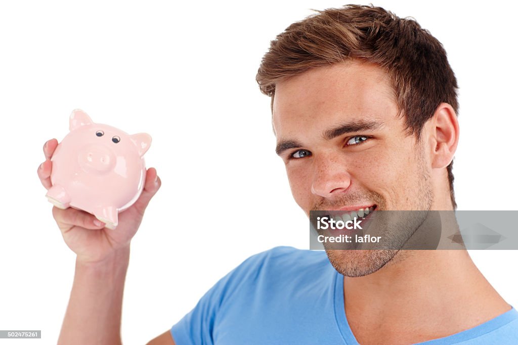 His hidden hoard for a rainy day Studio shot of a young man holding a piggy bankhttp://195.154.178.81/DATA/i_collage/pu/shoots/784557.jpg 20-24 Years Stock Photo