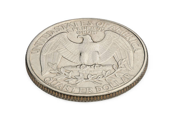 istock U.S. twenty five cents coin isolated on white background. macro 502475313