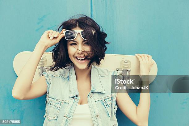 Young Brunette Woman Posing With Skateboard Stock Photo - Download Image Now - Teenager, Activity, Adult