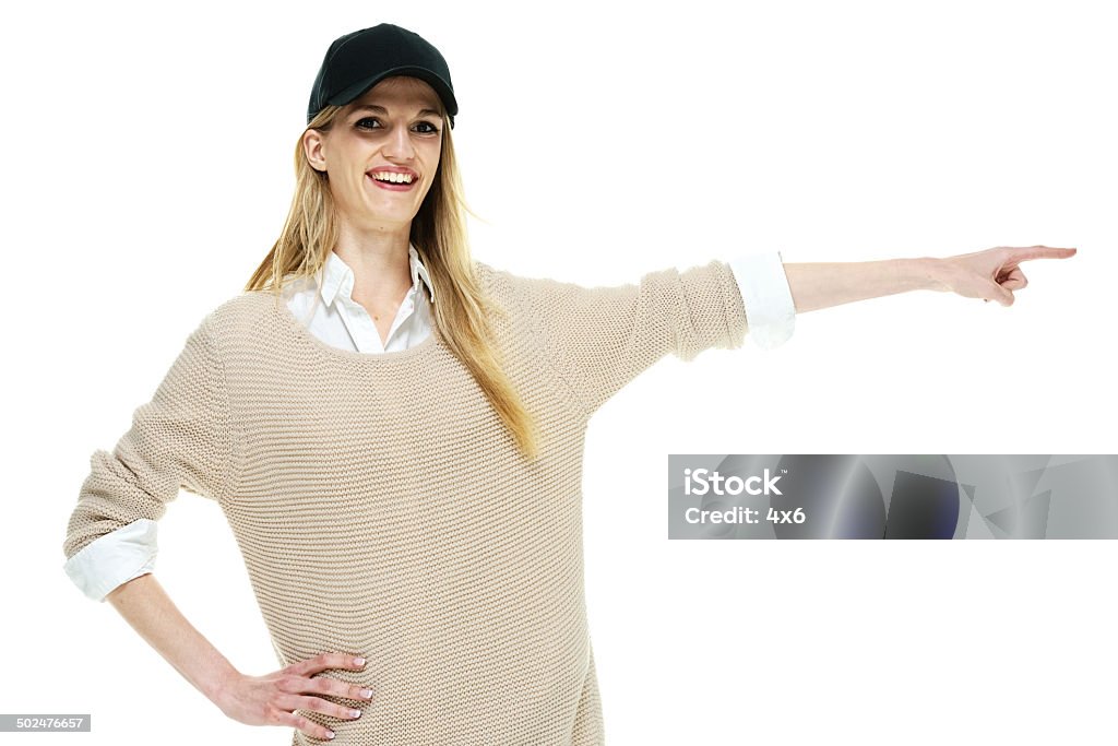 Fashionable smiling woman pointing away Fashionable smiling woman pointing awayhttp://www.twodozendesign.info/i/1.png 18-19 Years Stock Photo