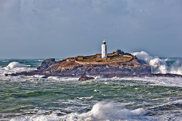 Lighthouse Storm The Lighthouse at Gwithian, in Cornwall during one of the many storms during the winter of 2013-14 st ives cornwall stock pictures, royalty-free photos & images