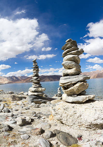Pangong Tso mountain lake panorama with Buddhist stupas in forefront stock photo
