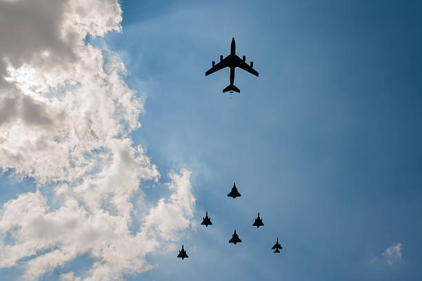 Military aircraft in formation Variety of military aircraft flying overhead in formation military tanker airplane photos stock pictures, royalty-free photos & images