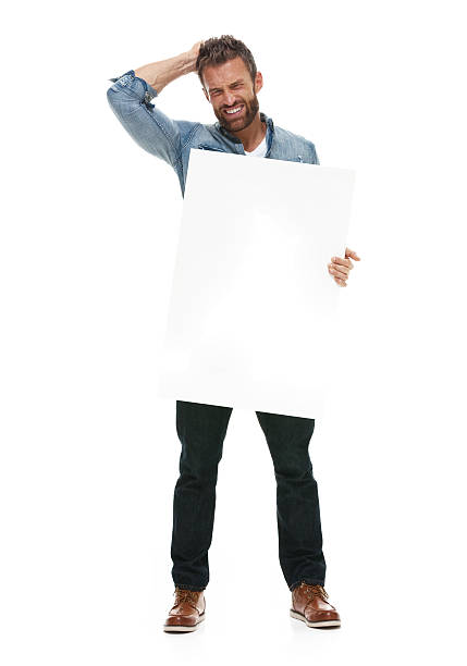 istock Angry casual man holding placard 502481020
