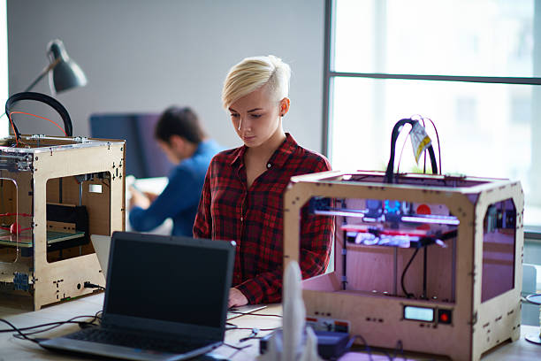 Technology of future Blonde woman creating model to print it on 3d printer 3d printing lab stock pictures, royalty-free photos & images